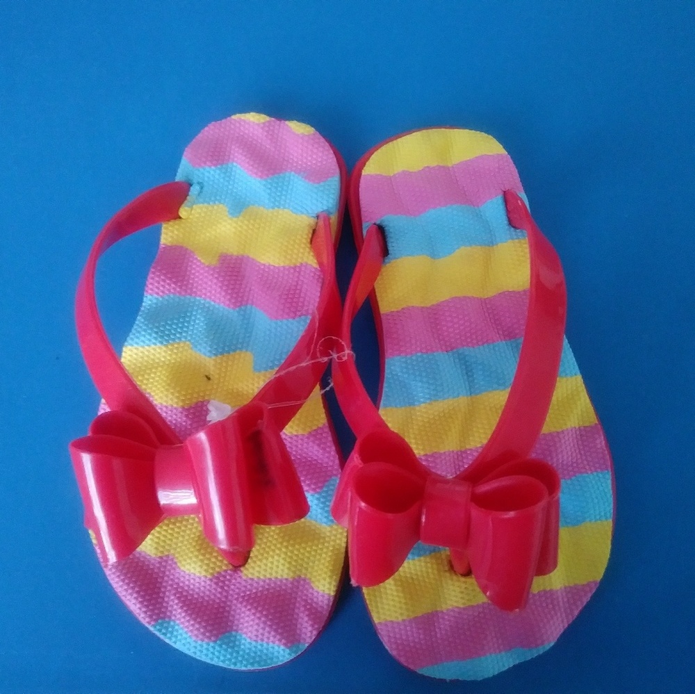 Never worn pair of Flip Flops